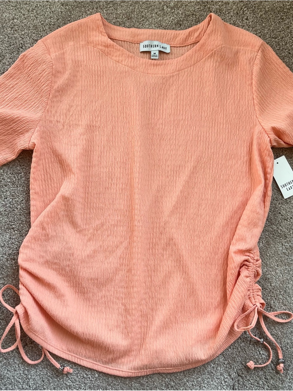 Southern Lady Peach Short Sleeve Ruched Side Knit Top. Size medium. Brand new
